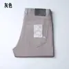 Pantalones Casuales de Verano Finos Nuevos para Hombre Color Sólido Cinco Bolsillos Simples Lujo Ligero Gama Alta Rectos Elásticos para Hombre