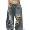 Pantalones vaqueros retro americanos desgastados con salpicaduras de tinta y detalles rotos, nuevo estilo primavera/otoño para mujer, con un estampado de letras de moda y un diseño de longitud hasta el suelo