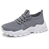 Zapatos de mujer, zapatillas deportivas transfronterizas, zapatos nuevos transpirables de talla grande, zapatos sencillos de punto volador, zapatos de malla absorbentes de impactos de suela gruesa al por mayor