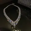 Traje de collar y pendientes de diamante ovalado europeo y americano exagerado luz de lujo alta gama cadena de clavícula nicho moda joyería al por mayor