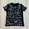 Camisa Pulôver Artística Estilo Europeu com Gola Redonda, Manga Curta, Caimento Solto, Estampa de Notas Musicais, Camiseta Casual Tendência Verão Street Rock