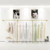 Estante de exhibición para tienda de ropa estante de hierro dorado para ropa de mujer ropa de niños colgante lateral de pared colgador de exhibición de pared