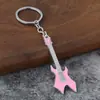 Nuevo llavero colgante de guitarra transfronterizo, colgante creativo de instrumento musical, aleación de zinc para decoración de mochila de estudiante DIY