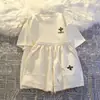 Traje informal de dos piezas para mujer, verano 2025, nuevo, pantalones cortos de manga corta, ropa deportiva holgada y relajada para hombres pequeños.