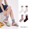 1698 Calcetines infantiles al por mayor, nuevos estilos otoño/invierno, con diseño de punto inverso y flecos, y una longitud única a media pantorrilla, hechos de algodón con un acabado sin costuras y borde crudo, para niñas
