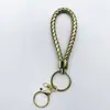 Venta al por mayor del fabricante Llavero de Cuerda de Aleación Tejida y Cuero Accesorios Colgantes Material PU Bolsas Pequeñas de Regalo Accesorios para Llaveros