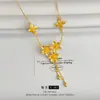 Família Zhou com série de casamento flor feliz flores brocado dourado três flores flor de quatro folhas corrente de borla atacado mulheres