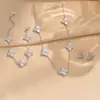 Pulseira de Aço Titânio Flor de Quatro Folhas Dupla Face com Um Diamante de um Lado e Uma Concha do Outro Lado, Pulseira de Uso Duplo, Conjunto de Decorações Moderno, Clássico e Versátil