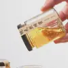 Venta al por mayor de fábrica botella de miel de seis caras transparente Botella para pepinillos botella para conservas botella de vidrio para mermelada botella para salsa de chile puede ser