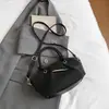 Bolso de hombro moderno y sencillo, nuevo bolso de mano para el verano de 2026, bolso tipo cubo informal de tendencia estilo coreano para mujer