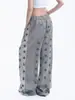 Calça comprida atlética casual, versátil e relaxada, de corte reto e modelagem solta, com design patchwork de padrão de estrelas estilo americano nos bolsos frontais e traseiros, unissex.