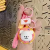 Líneas creativas de dibujos animados muñeco perrito llavero lindo colgante de muñeca coche bolsa pareja regalo pequeño venta al por mayor