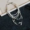 Collar de perlas con borlas florales transfronterizo europeo y americano, una cadena para la clavícula retro lujosa y de nicho, joyería de alta gama de moda al por mayor
