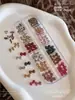 12 Compartimentos Estampado de Leopardo Joyería para Uñas con Moño Estilo Dulce Fresco Sexy Corbata de Moño Corazón Diamante de Uña de Resina Decoración Venta al por Mayor