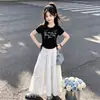 2026 Nuevo Conjunto Casual de Dos Piezas para Niños Mayores: Camiseta Elegante y Dulce con Lazo y Falda Estilo Princesa