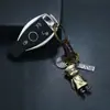 Llavero Simple Tejido a Mano de Cuero Genuino Aleación Pequeño Zombi Retro Llavero de Piel de Vaca Colgante Creativo Pequeño Regalo