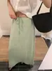 Tamanhos atualizados. Saia midi casual e versátil estilo coreano na cor verde maçã, saia reta slim de cintura alta para mulheres, verão 2026