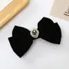 Pasador estilo Chanel pasador lazo de terciopelo negro accesorios para el cabello femenino otoño e invierno parte trasera de la cabeza pinza de resorte tocado estilo francés