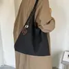 Bolso de moda versátil de un solo hombro para el día a día, nuevo bolso tejido elegante de gran capacidad para mujer 2026, tote de moda para otoño