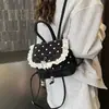 Mochila Feminina Linda de Bolinhas com Laço de Renda 2026 Nova Versátil Tendência Pequena de Alta Qualidade