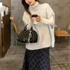 Chaleco de punto otoño-invierno con cuello alto superpuesto, diseñado para mujer para llevar como capa exterior, con un estilo relajado, suave y cómodo, cuello alto y diseño sin mangas, perfecto para llevar en capas.