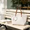 Bolsa feminina de grande capacidade transfronteiriça, nova moda outono 2026 bolsa de ombro, bolsa tote de textura casual de nicho para o dia a dia
