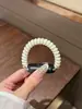 Adequado para Apple Watch iWatch10, novo modelo de verão, pulseira amarela clara tipo mola de telefone 2026, atacado do fabricante
