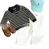 Conjunto de polo a rayas de manga larga para niño estilo coreano de otoño 2026 nuevo moderno versátil pantalones casuales para niños