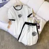 Traje Deportivo Casual 2025 Primavera y Otoño Nuevo Camelia Color Sólido Reductor de Edad Top de Manga Corta y Pantalones Deportivos Conjunto de Dos Piezas