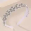 Accesorios para el cabello de niñas europeas y americanas transfronterizos, diseño minimalista de nicho, decoración de lazo blanco grande, lindos accesorios de diadema para niños