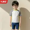 Traje de baño para niños Niños Niños medianos y grandes Dividido 2026 Estilo nuevo Niños Adolescentes Traje de baño Bañador Pantalones cortos de baño Set con protección solar