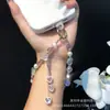Cadena para Teléfono Móvil al por Mayor Aleación Amor Circonita Borla Cadena Colgante Acrílico Rosa Muñeca con Cuentas Correa para Funda de Teléfono Móvil