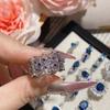 Suministro de Joyería Camelia Nuevo Anillo Tesoro Color Corindón Azul Anillo de Lujo Francés Alta Imitación Diópsido Natural