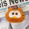 Peluche de Garfield de dibujos animados explosivo súper lindo con sonido, colgante, accesorios para el cabello de Garfield, empaque individual, accesorios de peluche, lote
