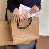 Loja de roupas de celebridade da internet bolsa de mão não tecido logotipo personalizado roupas compras presente bolsa atacado