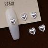 Nuevos accesorios de aleación para decoración de uñas con forma de corazón torcido tridimensional liso con diseño de amor hueco retro japonés