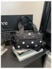 Bolsa de Hombro Tejida Estilo Milenial para el Trayecto Diario Europeo y Americano 2026 Bolso Baguette Mango Largo Forma de Corazón Retro Versátil Nicho Bolso para Mujer