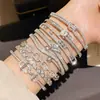 Pulsera Hebilla Oval Hueca de Circonita Chapada en Oro Real de 18K Elegante y Moderna Cadena de Mano Joyería de Mano de Nicho de Alta Gama para Mujeres