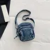 Bolso de mezclilla para mujer, nueva moda primavera 2026, nicho elegante, bolso de hombro cruzado, bolso de teléfono móvil de alta estética moderno