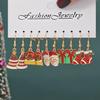 Pendientes navideños europeos y americanos con combinación de aleación, muñeco de nieve, copo de nieve, alce y árbol de Navidad.
