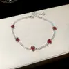 [Cadena de Diamantes Arcoíris] Pulsera de extracción de zircón trenzado en cruz, una pulsera lujosa y de alta gama, una pieza de joyería delicada y de moda