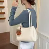 Bolso de mano simple de alta costura estilo coreano, bolso tipo cubo de nicho para el día a día, nuevo modelo 2026, bolso de hombro y axila elegante y versátil
