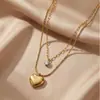 Collar de acero inoxidable de doble capa con forma de corazón estilo europeo y americano, incrustaciones de circonita, electrochapado al vacío, apilable, cadena para clavícula de mujer de lujo ligero