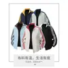 Directo de fábrica, chaqueta a rayas estilo americano para hombres y mujeres, nueva chaqueta reversible de primavera para parejas, ropa de primavera