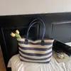 Bolso de Mano y Hombro Tejido de Paja de Gran Capacidad Simple para Mujer 2026 Verano Nuevo Bolso Tote Rayado para Dama Venta al por Mayor