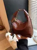 Bolso Retro Tipo Dumpling para Mujer Otoño e Invierno 2026 Nuevo Casual Versátil Cruzado Bolso de Mano Pequeño de Alta Gama Moderno