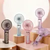 2026 Ventilador de Mão Transparente Simples Criativo Ventilador Pequeno Portátil de Verão para Exterior com Clipe Recarregável via USB