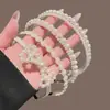 Elegante tiara de pérolas artificiais para mulheres, novo modelo 2026, versátil para sair, coroa alta, acessório de cabelo estiloso para o verão