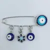 Europa y Estados Unidos Nuevo broche Ojo de Diablo Pin de punto para mujer Joyería de aleación para corsage Hebilla para toalla de seda anti-luz Venta al por mayor