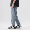 Venta al por mayor de ropa para hombre Xintang: Jeans retro nuevos de primavera para hombre, estilo harén holgado, marca de moda con rotos, pantalones largos de primavera